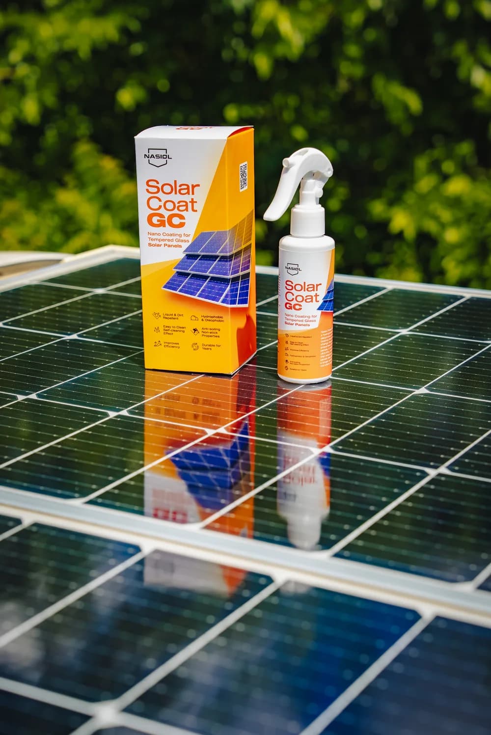 SolarCoat GC bottle and orange packaging reflected in a solar panel